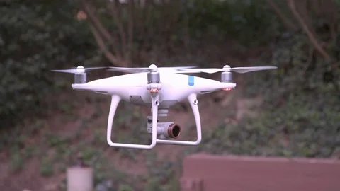 Phantom drone hovering in backyard taken in slow motion Stockbeeldmateriaal 94093028