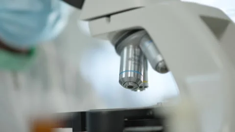 Pharma Company Lab Technician Adjusting Microscope for Quality Control Test Stock Footage 338358461