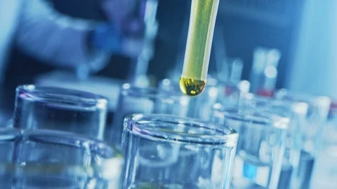 Pharma Lab: Pipette Dropping Yellow Liquid into Test Tubes, Medical Research Stock Footage 121783283