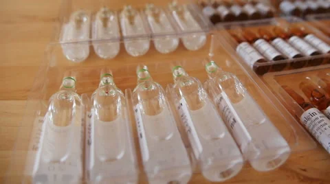 Pharmaceutical Ampules on the Table Stock Footage 48320972