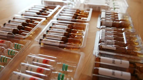 Pharmaceutical Ampules on the Table Stock Footage 48321761