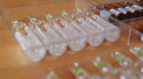 Pharmaceutical Ampules on the Table Stock Footage 48321841