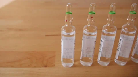 Pharmaceutical Ampules on the Table Stock Footage 48385443