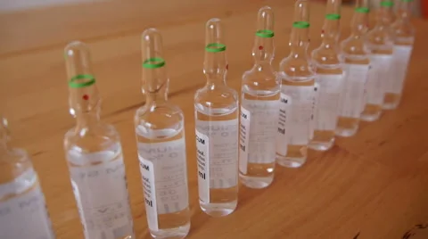 Pharmaceutical Ampules on the Table Stock Footage 48385483