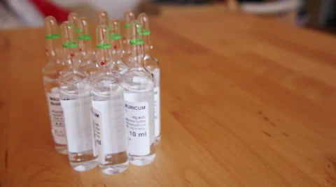 Pharmaceutical Ampules on the Table Stock Footage 48385505