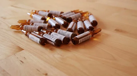 Pharmaceutical Ampules on the Table Stock Footage 48409047