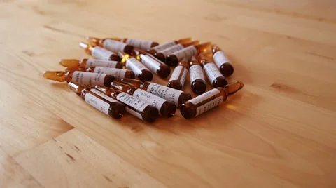 Pharmaceutical Ampules on the Table Stock Footage 48409148