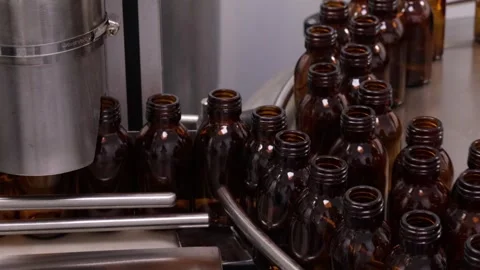 Pharmaceutical and cosmetic production facility conveyor for filling product Stock Footage 340144005