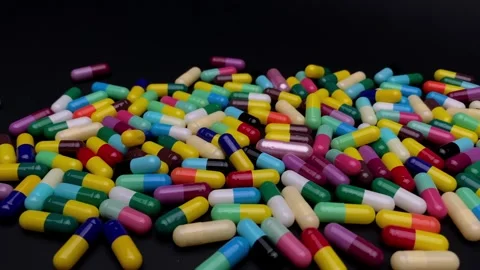 Pharmaceutical capsules on a rotating stand Stock Footage 252792268