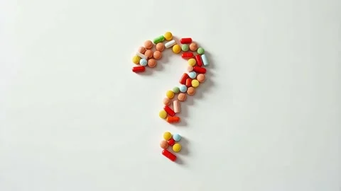 The pharmaceutical creativity of a question mark of colored pills Stock Footage 305334720