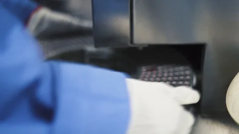 Pharmaceutical Industry concept. Machine drum with pills being checked by Stock Footage 119286547