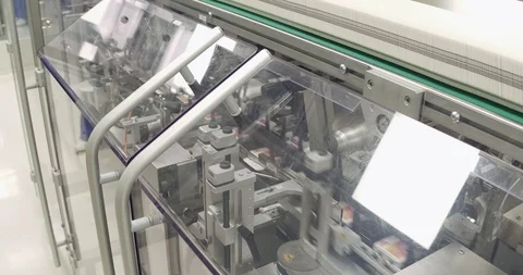Pharmaceutical industry. Line machine conveyer for packaging pills at factory. Stock Footage 101097636