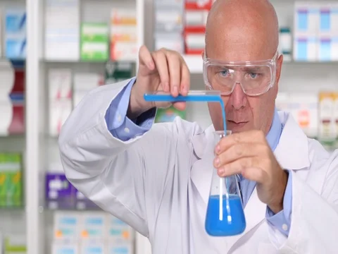 Pharmaceutical Laboratory Chemist Man Preparing One Medication Liquid Solution Stock Footage 75743147