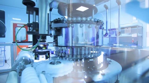Pharmaceutical manufacturing line. Medical vials at production line Stock Footage