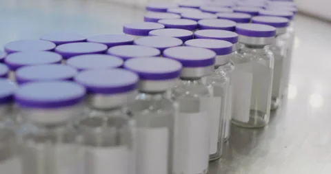 Pharmaceutical manufacturing line producing vials Stock Footage 295219151