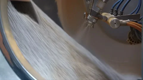 Pharmaceutical Tablet Coating Machine Spraying Pills in Automated Factory Stock Footage 340321193