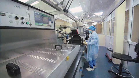Pharmaceutical worker examines and controls the production line. woman in Video stock 200855936