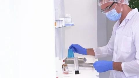 Pharmaceutical worker performs chemical analysis Stock Footage 117405722