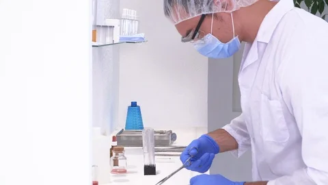 Pharmaceutical worker performs chemical analysis Stock Footage 117433781