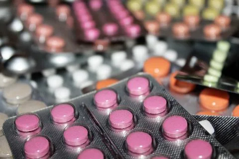 Pharmaceuticals antibiotics tablets capsule in a blister defocused Stock Photos
