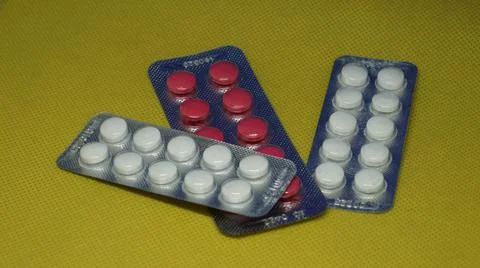 Pharmaceuticals antibiotics tablets three packs of different colors Stock Photos
