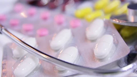 Pharmaceuticals capsule tablets with a medicinal antibiotic Stock Footage 121014637