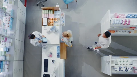 Pharmacist and Customer in Pharmacy Top View Stock Footage 147223261