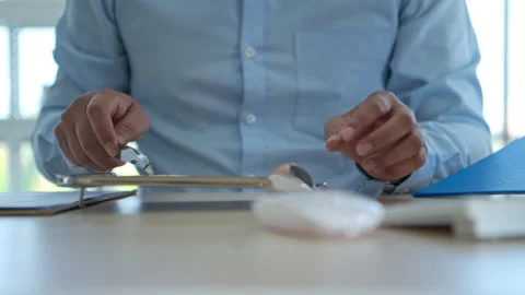 The pharmacist is arranging medications on sorting trays and counting Video stock 339057352