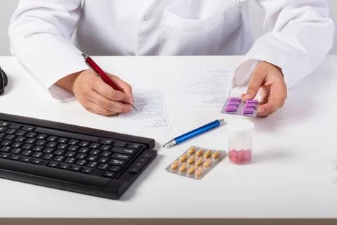 Pharmacist checking prescription Stock Photos