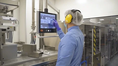 Pharmacist control pharmaceutical manufacturing process at drug factory using Stock Footage