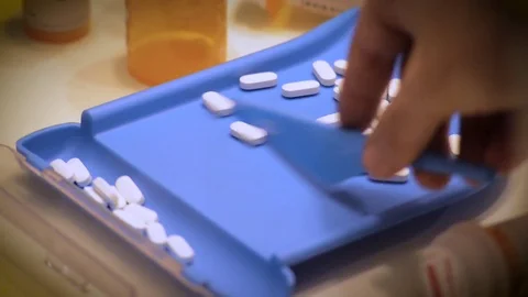 Pharmacist Counting Prescription Medication Stock Footage