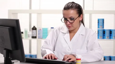 Pharmacist entering information Stock Footage 7752398