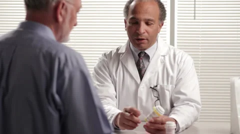 Pharmacist explaining prescription to customer Stock Footage 2923330
