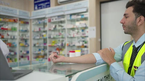 The pharmacist explains the use of medicines to the engineers Stock Footage 308357302