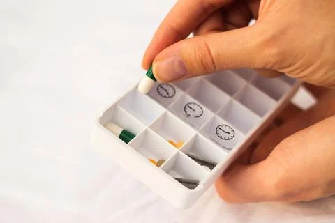 Pharmacist holding a pill Stock Photos