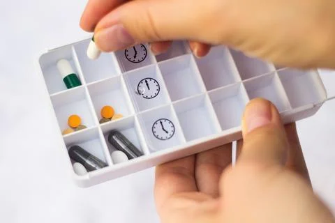 Pharmacist holding a pill Stock Photos