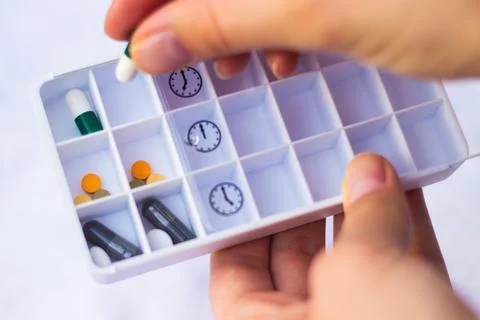Pharmacist holding a pill Stock Photos