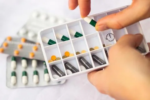 Pharmacist holding a pill Stock Photos