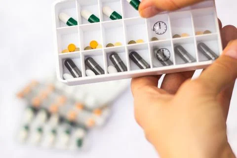 Pharmacist holding a pill Stock Photos