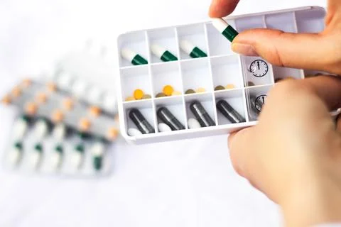 Pharmacist holding a pill Stock Photos