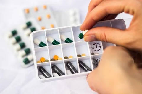 Pharmacist holding a pill Stock Photos