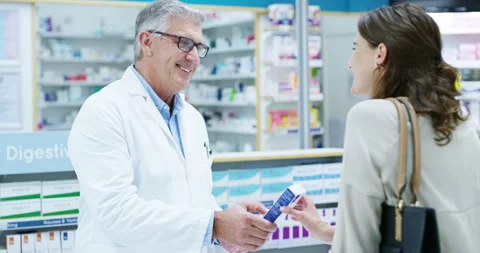 Pharmacist, man and customer in pharmacy with medicine, pills or medication Video stock 254183283