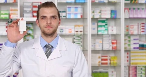 Pharmacist Man Holding Drog Box Medicine Showing Ok Sign Camera in Pharmacy Shop Stock Footage 75826259