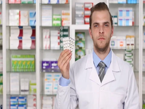 Pharmacist Man Holding Tablet Pills and Showing Ok Sign Promote Pharmacy Concept Stock Footage 80271020