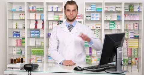 Pharmacist Man Introducing Salute Showing Ok and Thumb Up Pharmacy Presentation Video stock 76995463
