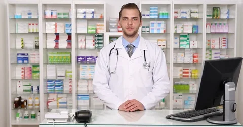 Pharmacist Man Marketing Talking Camera Answer to a Question in Pharmacy Concept Stock Footage 73564756