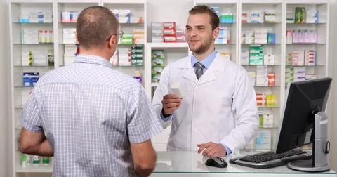 Pharmacist Man Presentation Client Drug Box Medicine Advise Treatment Pharmacy Stock Footage 75826290