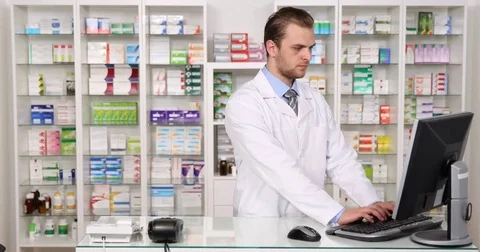 Pharmacist Man Use Computer Talking Phone Ordering Drugs Pharmacy Deposit Stock Stock Footage 75844743