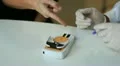 pharmacist measure cholesterol and glucose to a patient HD Footage
