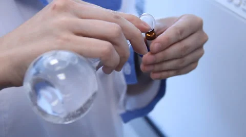 Pharmacist mixes the liquid Stock-Footage 47170761